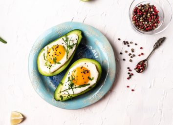 avocado baked eggs, concept of full-fat foods for weight loss
