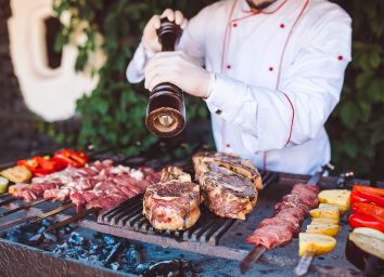 chef grilling meat and vegetables