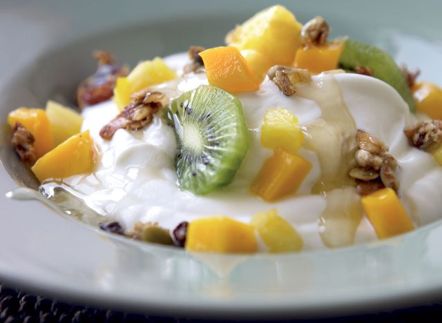 Gluten-free yogurt with pineapple kiwi mango and ginger syrup