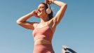 happy woman exercising outdoors, listening to music, concept of inspirational quotes to get moving
