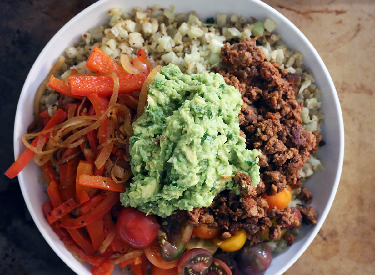 whole 30 burrito bowl with guacamole on top